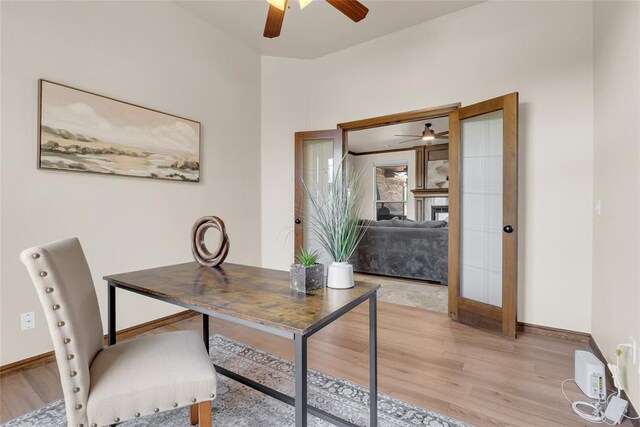 4679 Hillcrest Ln, Edmond, OK 73025 - office area with a ceiling fan, baseboards, and light wood-style floors