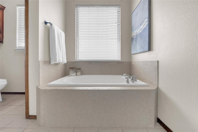 4679 Hillcrest Ln, Edmond, OK 73025 - bathroom with a bath and tile patterned floors