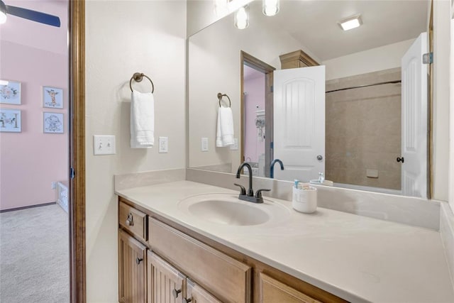 4679 Hillcrest Ln, Edmond, OK 73025 - bathroom featuring vanity and a ceiling fan