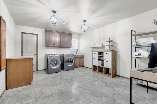 4679 Hillcrest Ln, Edmond, OK 73025 - laundry room with cabinet space, washing machine and clothes dryer, and a desk