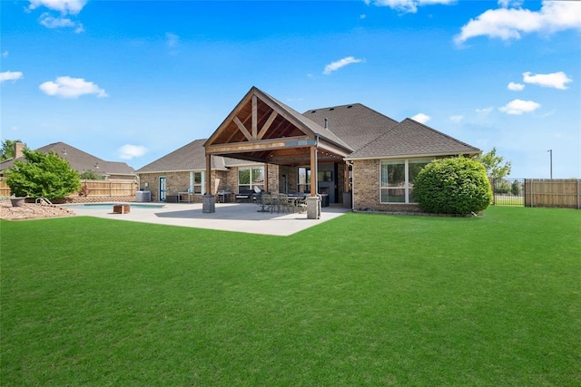 4679 Hillcrest Ln, Edmond, OK 73025 - back of property featuring a fenced backyard, a patio area, brick siding, and a shingled roof