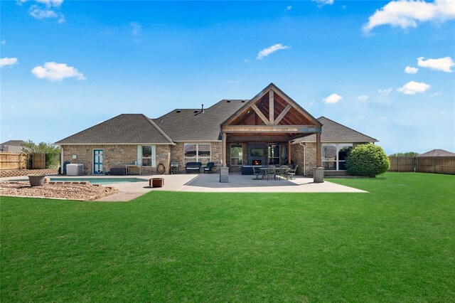 4679 Hillcrest Ln, Edmond, OK 73025 - back of property featuring a fenced backyard, a patio, brick siding, and a shingled roof