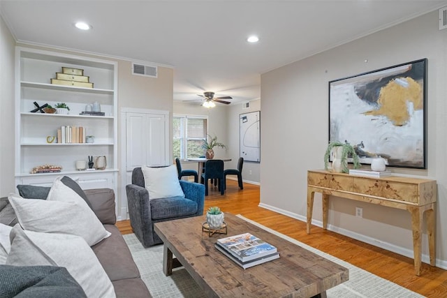 living room featuring visible vents, a ceiling fan, light wood-style flooring, and recessed lighting