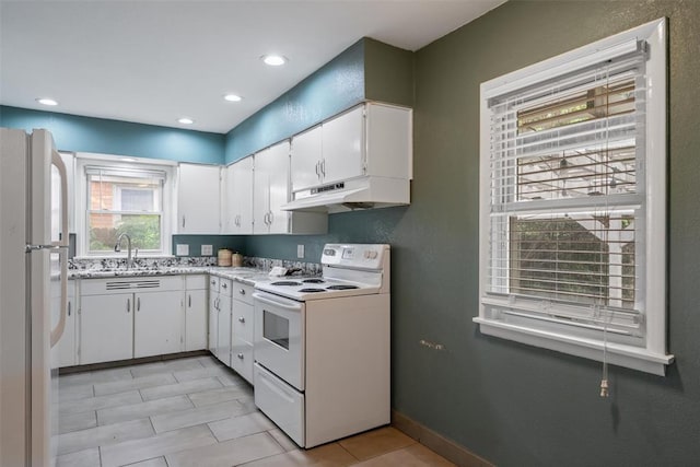 kitchen with white cabinets, a sink, white appliances, recessed lighting, and under cabinet range hood