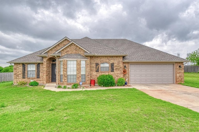 908 County St Unit 2932, Tuttle, OK 73089 - single story home featuring a garage, fence, a front yard, brick siding, and concrete driveway