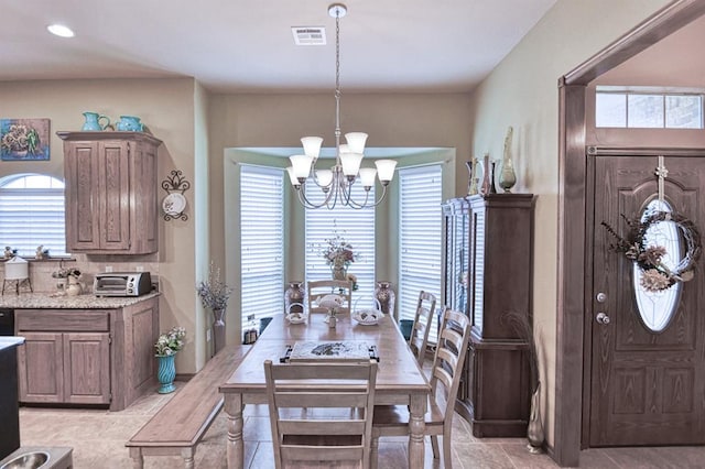 908 County St Unit 2932, Tuttle, OK 73089 - dining room with light tile patterned flooring, a notable chandelier, visible vents, and a toaster