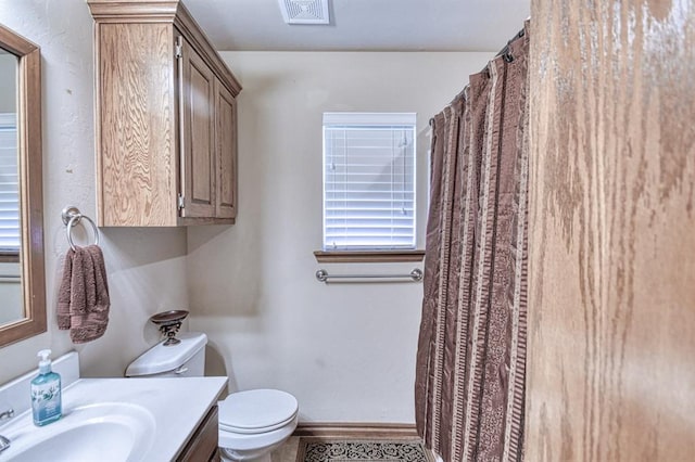 908 County St Unit 2932, Tuttle, OK 73089 - bathroom with vanity, baseboards, toilet, and visible vents