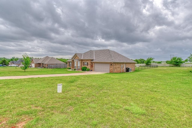 908 County St Unit 2932, Tuttle, OK 73089 - exterior space featuring an attached garage, a front lawn, fence, and concrete driveway
