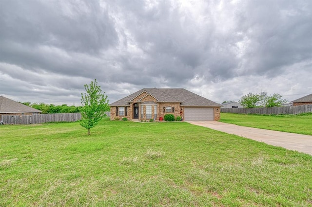 908 County St Unit 2932, Tuttle, OK 73089 - ranch-style house featuring a front lawn, fence, brick siding, concrete driveway, and an attached garage