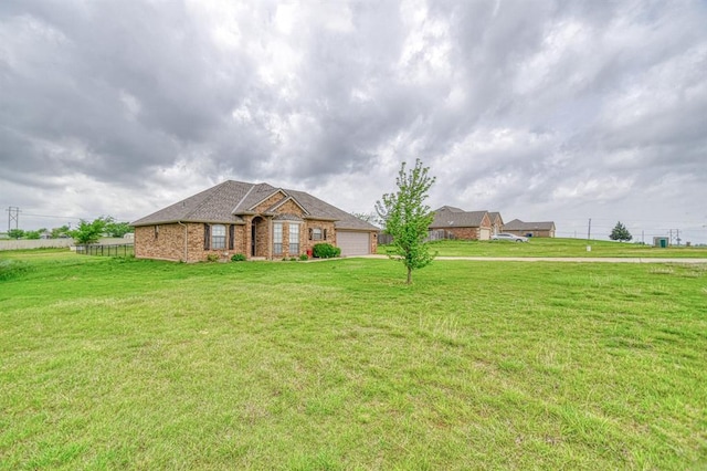 908 County St Unit 2932, Tuttle, OK 73089 - ranch-style house with a garage, fence, brick siding, and a front yard
