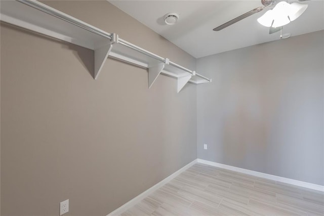 7217 SW 120th St, Oklahoma City, OK 73173 - spacious closet featuring light wood finished floors and a ceiling fan
