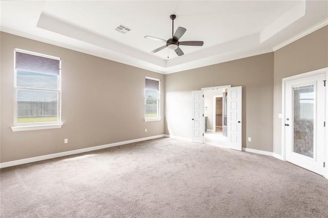 7217 SW 120th St, Oklahoma City, OK 73173 - unfurnished bedroom featuring carpet, visible vents, a tray ceiling, and baseboards