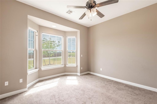 7217 SW 120th St, Oklahoma City, OK 73173 - unfurnished room with baseboards, visible vents, ceiling fan, and carpet flooring