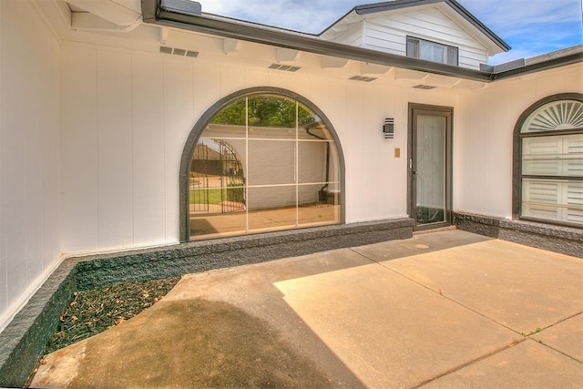 7705 Rumsey Rd, Oklahoma City, OK 73132 - view of exterior entry featuring a patio and visible vents