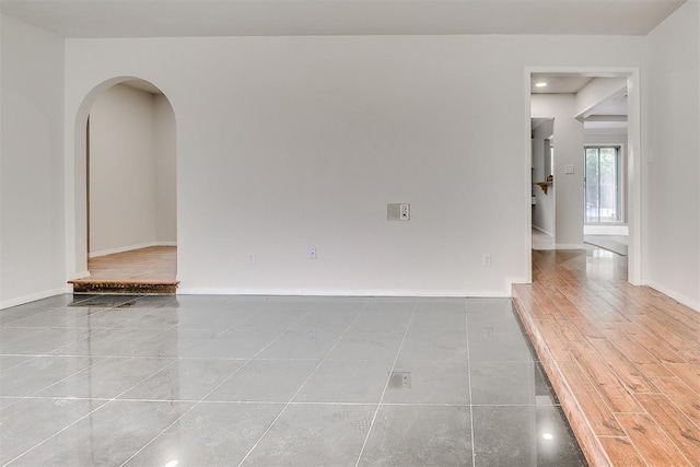 7705 Rumsey Rd, Oklahoma City, OK 73132 - spare room featuring baseboards, recessed lighting, and arched walkways