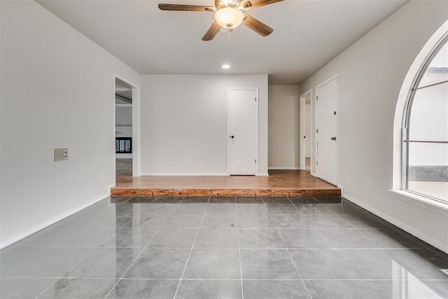 7705 Rumsey Rd, Oklahoma City, OK 73132 - interior space featuring a ceiling fan and baseboards