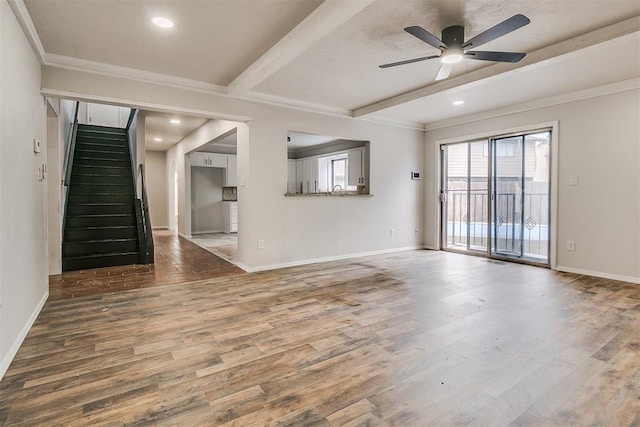 7705 Rumsey Rd, Oklahoma City, OK 73132 - unfurnished living room with baseboards, wood finished floors, a ceiling fan, and beamed ceiling