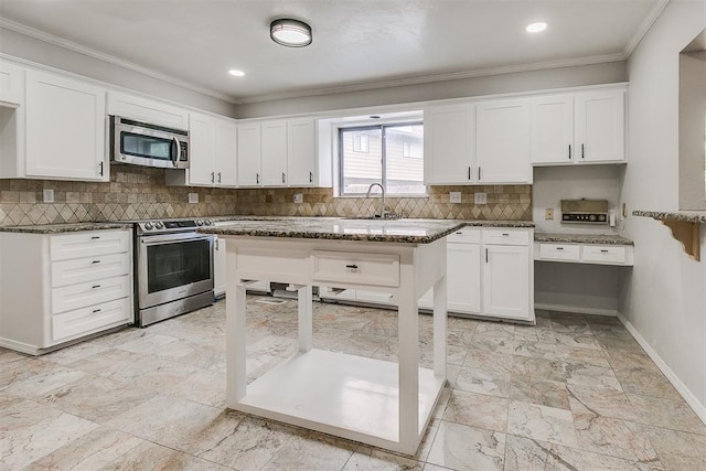 7705 Rumsey Rd, Oklahoma City, OK 73132 - kitchen with decorative backsplash, dark stone countertops, white cabinetry, ornamental molding, and appliances with stainless steel finishes