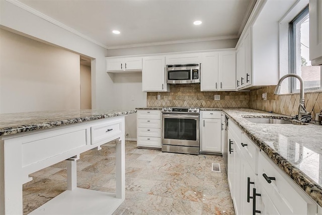 7705 Rumsey Rd, Oklahoma City, OK 73132 - kitchen with light stone counters, white cabinetry, a sink, stainless steel appliances, and ornamental molding