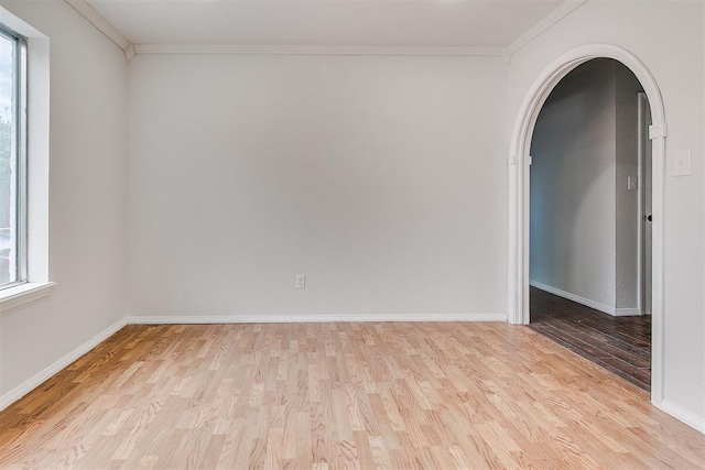 7705 Rumsey Rd, Oklahoma City, OK 73132 - unfurnished room featuring wood finished floors, baseboards, ornamental molding, and arched walkways