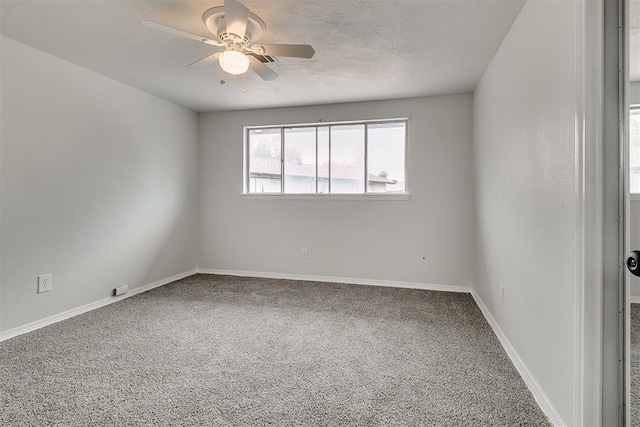 7705 Rumsey Rd, Oklahoma City, OK 73132 - spare room with a textured ceiling, ceiling fan, carpet floors, and baseboards