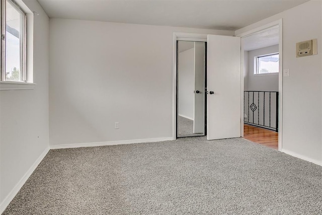 7705 Rumsey Rd, Oklahoma City, OK 73132 - unfurnished bedroom with baseboards, a closet, and carpet flooring