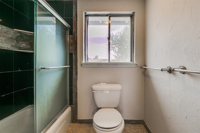 7705 Rumsey Rd, Oklahoma City, OK 73132 - full bathroom with toilet, enclosed tub / shower combo, and baseboards