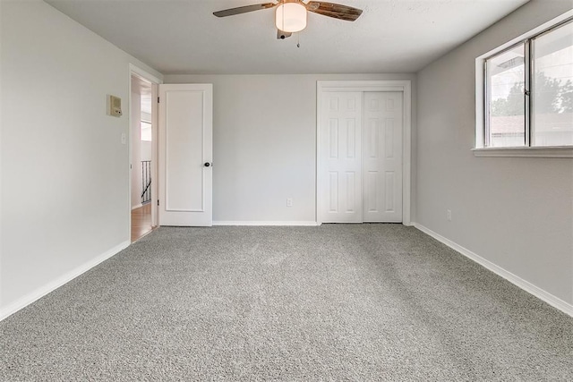 7705 Rumsey Rd, Oklahoma City, OK 73132 - unfurnished bedroom featuring baseboards, ceiling fan, carpet floors, and a closet