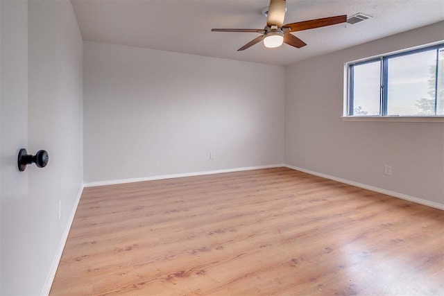 7705 Rumsey Rd, Oklahoma City, OK 73132 - empty room with wood finished floors, visible vents, ceiling fan, and baseboards