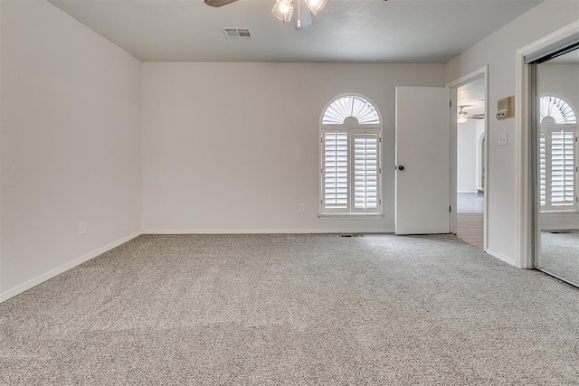 7705 Rumsey Rd, Oklahoma City, OK 73132 - carpeted empty room with baseboards, visible vents, and a ceiling fan