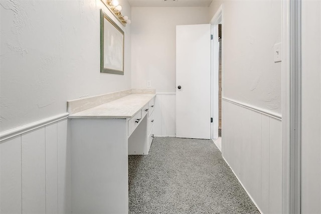 7705 Rumsey Rd, Oklahoma City, OK 73132 - hallway with a decorative wall and wainscoting