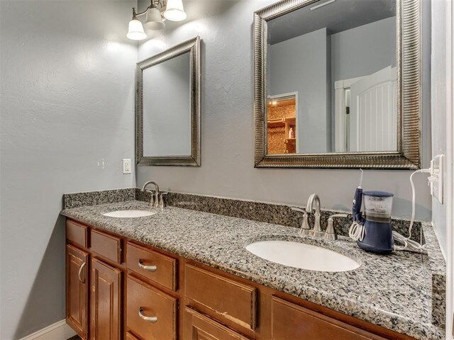 bathroom with double vanity and a sink