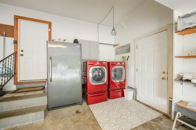 laundry room featuring cabinet space and separate washer and dryer