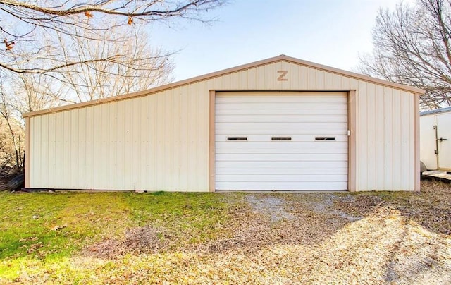 detached garage featuring driveway
