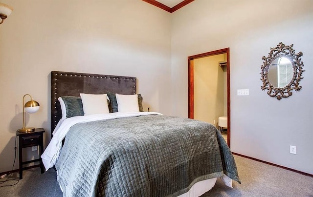 bedroom with ornamental molding, carpet flooring, and baseboards