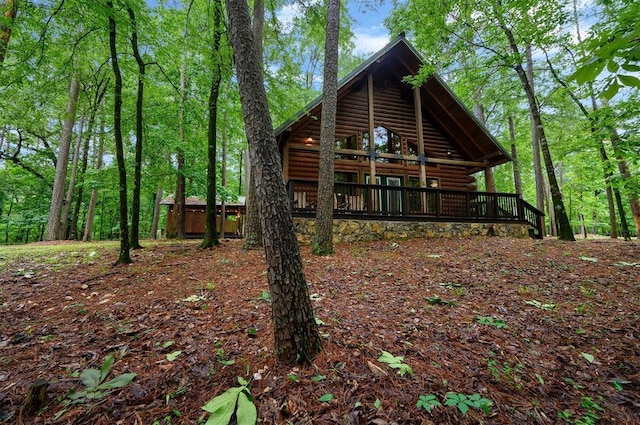 view of home's exterior with faux log siding