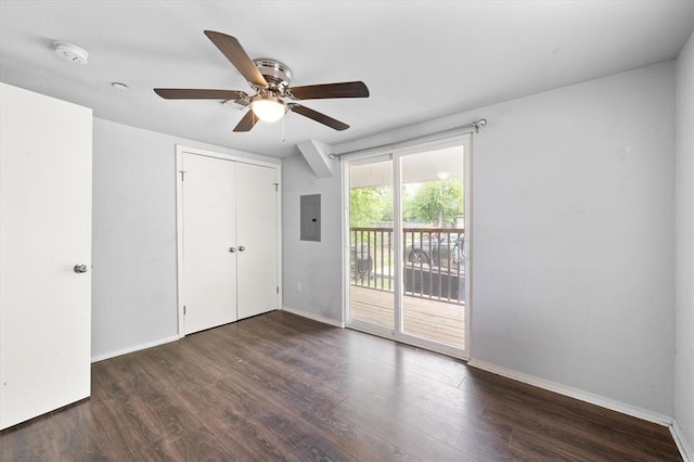 unfurnished bedroom with baseboards, access to exterior, a ceiling fan, and wood finished floors