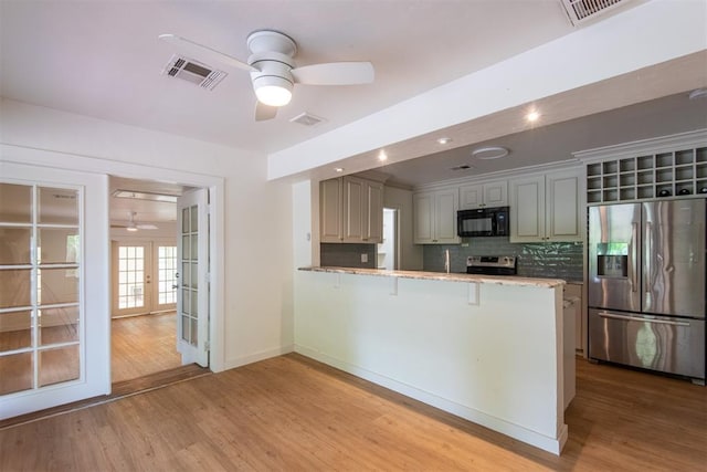 73 E Shore Dr, Arcadia, OK 73007 - kitchen featuring stainless steel appliances, ceiling fan, visible vents, a peninsula, and french doors