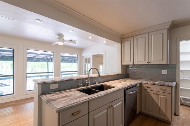73 E Shore Dr, Arcadia, OK 73007 - kitchen featuring stainless steel dishwasher, light wood-style flooring, a sink, ornamental molding, and a peninsula