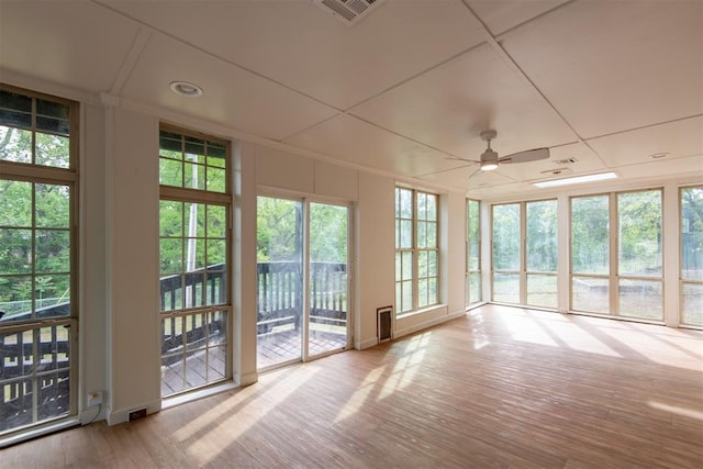 73 E Shore Dr, Arcadia, OK 73007 - unfurnished sunroom with a wealth of natural light, visible vents, and wood finished floors