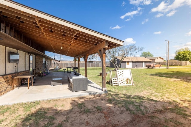 view of yard with fence and a patio