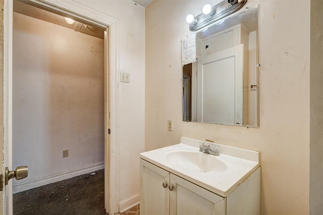 bathroom featuring vanity and baseboards