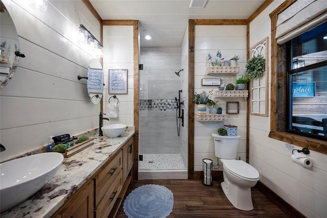 1329 Lake Ridge Ln, Broken Bow, OK 74728 - full bath with a stall shower, wood finished floors, toilet, double vanity, and recessed lighting