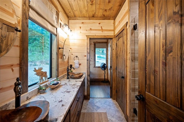 1329 Lake Ridge Ln, Broken Bow, OK 74728 - bathroom with wooden ceiling, wood walls, and vanity