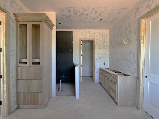 bathroom featuring concrete flooring