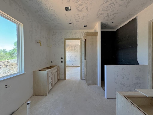 hall featuring unfinished concrete floors