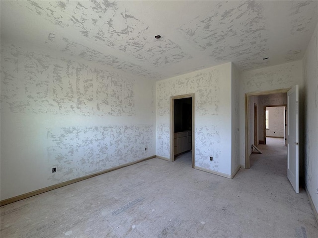 unfurnished bedroom with baseboards