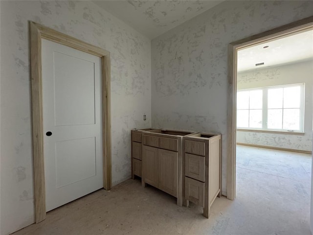 interior space with wallpapered walls
