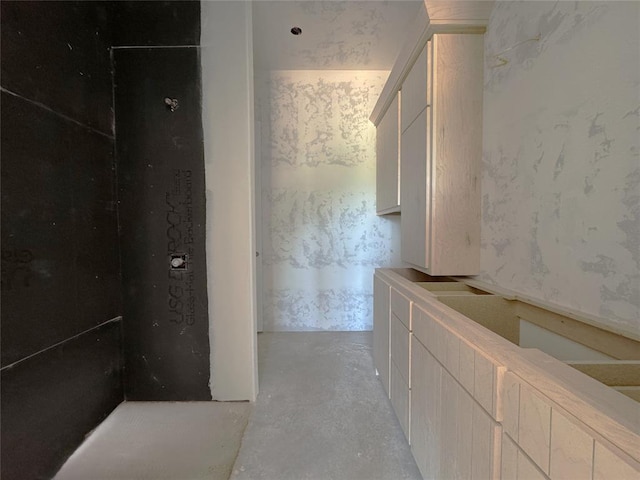 bathroom with concrete flooring