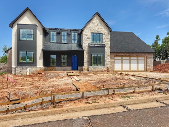 view of front of house with stucco siding, fence, and stone siding